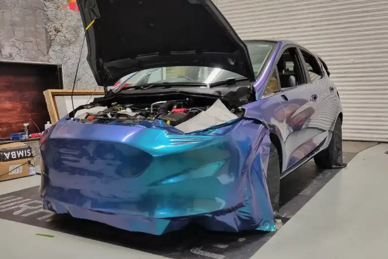 Ford Fiesta flip colour change wrap installation in progress on the front bumper at Wrap Your Car Kidderminster