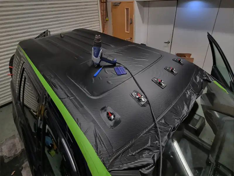 Carbon fibre vinyl wrap applied to vehicle roof at our Kidderminster workshop