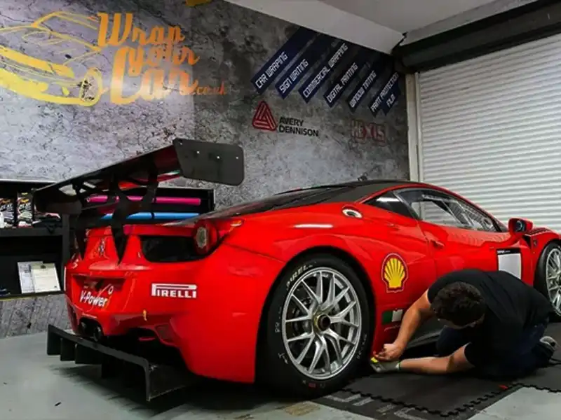 Detail vinyl wrap installation on red sports car at our Kidderminster workshop
