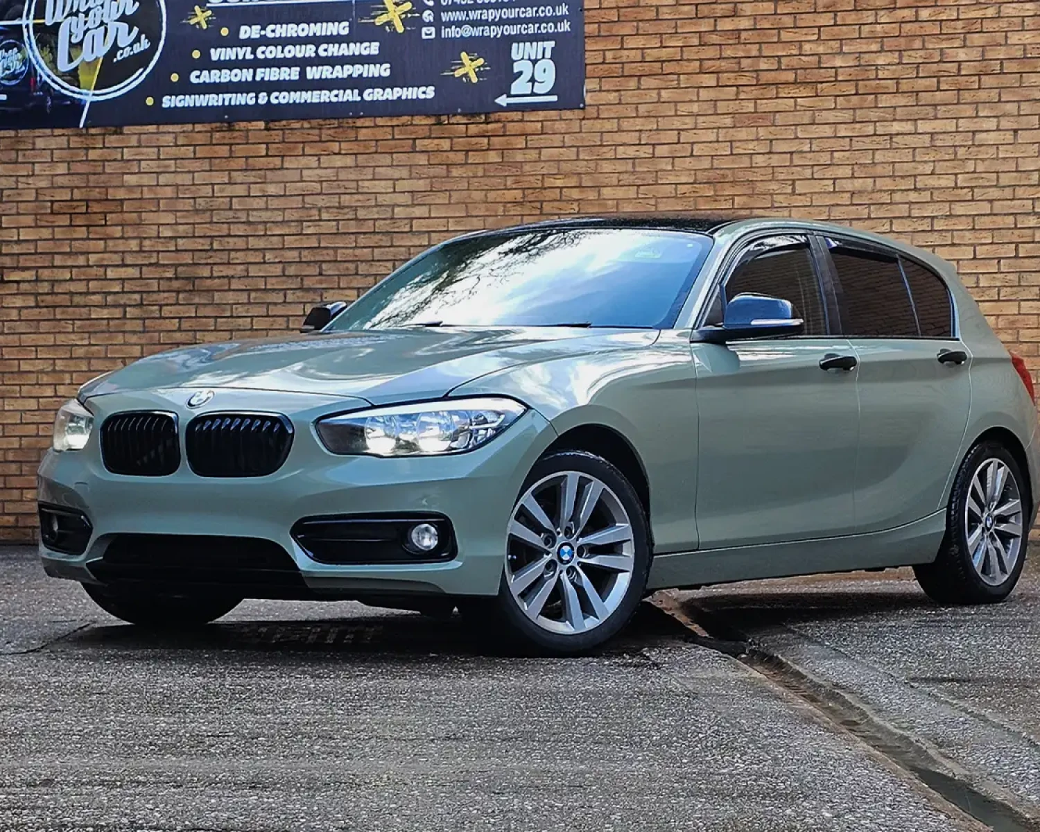 Full colour change vinyl wrap in khaki green on BMW 1 Series