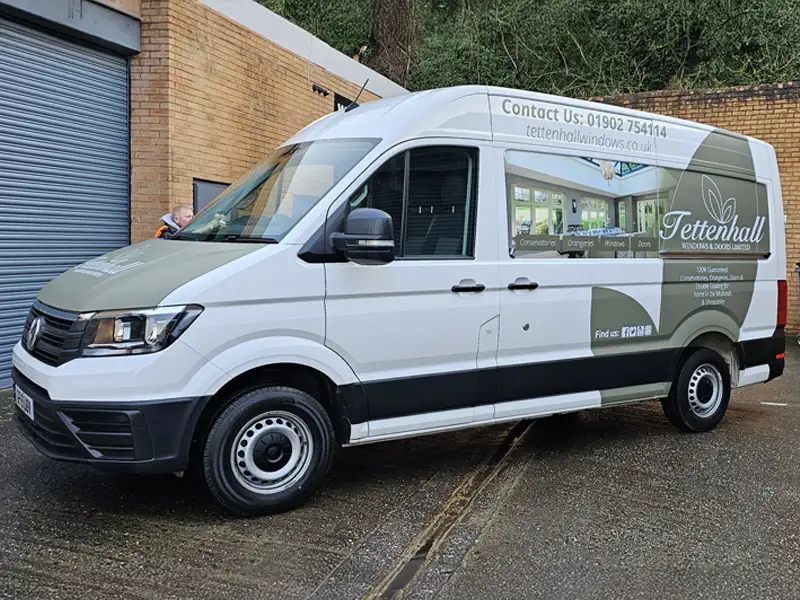 Partial commercial vehicle wrap on a Volkswagen Crafter van with branding graphics in Kidderminster